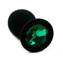 Силиконовая анальная пробка средняя чёрная с зелёным кристаллом